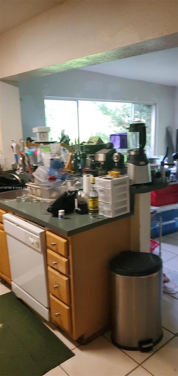 5713 Seton Drive Margate, FL 33063 - Photo 11 of 17 a kitchen with stainless steel appliances granite countertop a sink and a stove