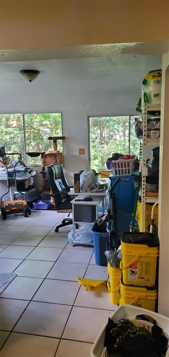 5713 Seton Drive Margate, FL 33063 - Photo 10 of 17 a living room with furniture and a floor to ceiling window