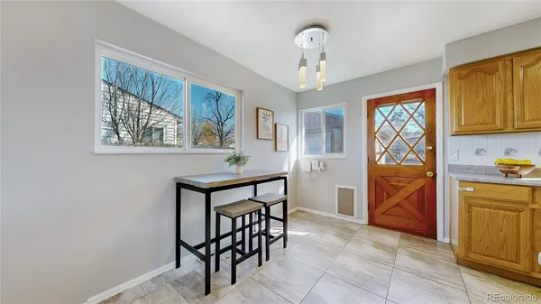 a view of kitchen with cabinets and furniture