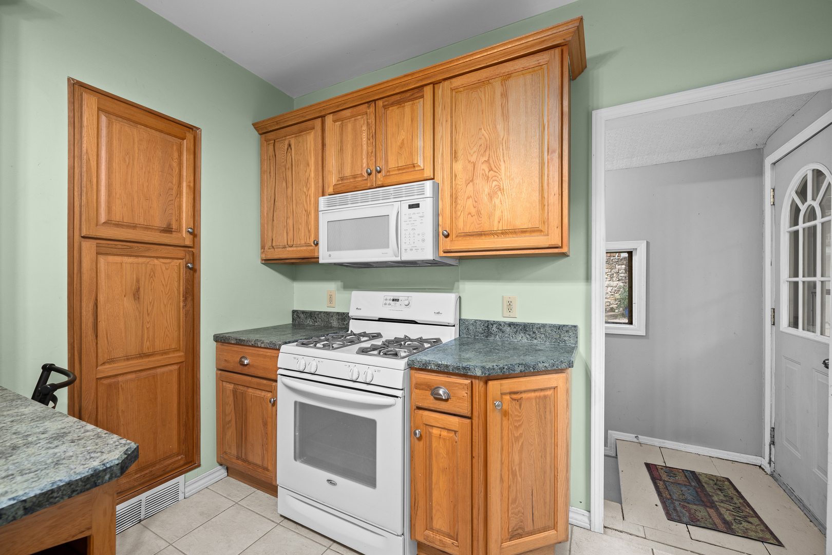 802 North High Street Port Byron, IL 61275 - Photo 21 of 43 a kitchen with granite countertop cabinets stainless steel appliances and a counter space