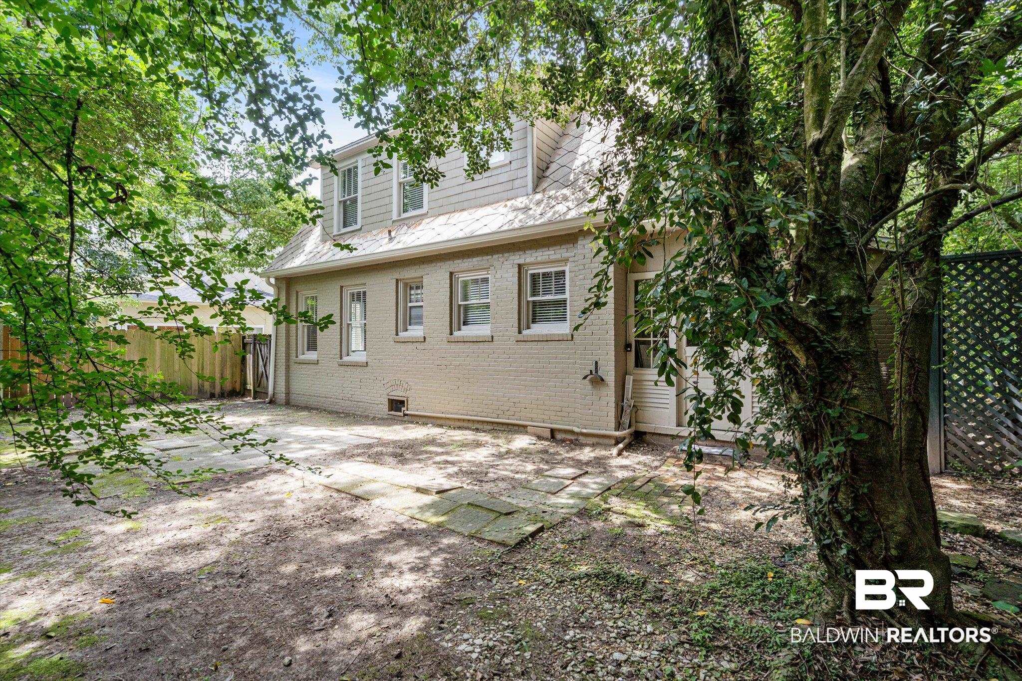 1159 Palmetto Street Mobile, AL 36604 - Photo 17 of 21 Back of property with a patio