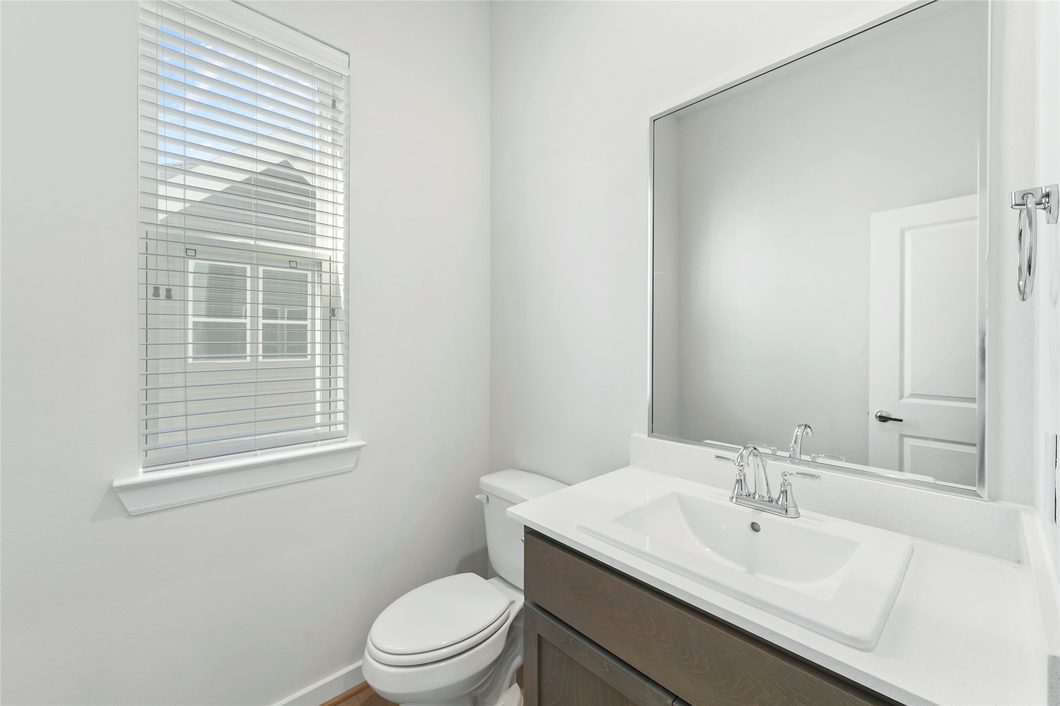 1013 Erin Street, Unit V Houston, TX 77009 - Photo 11 of 25 a bathroom with a sink a toilet and a window