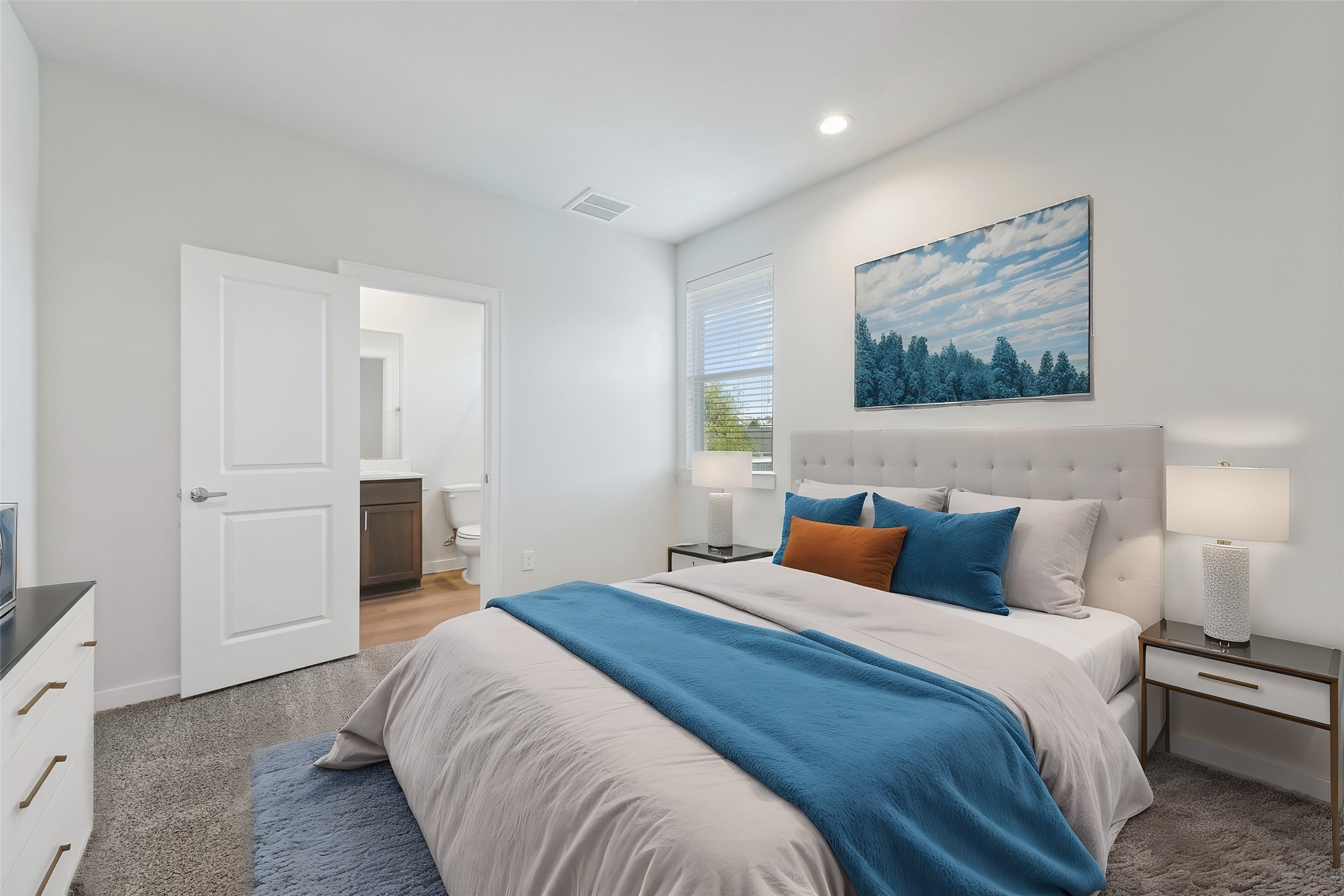 1013 Erin Street, Unit V Houston, TX 77009 - Photo 13 of 25 a bedroom with a bed and painting on the wall