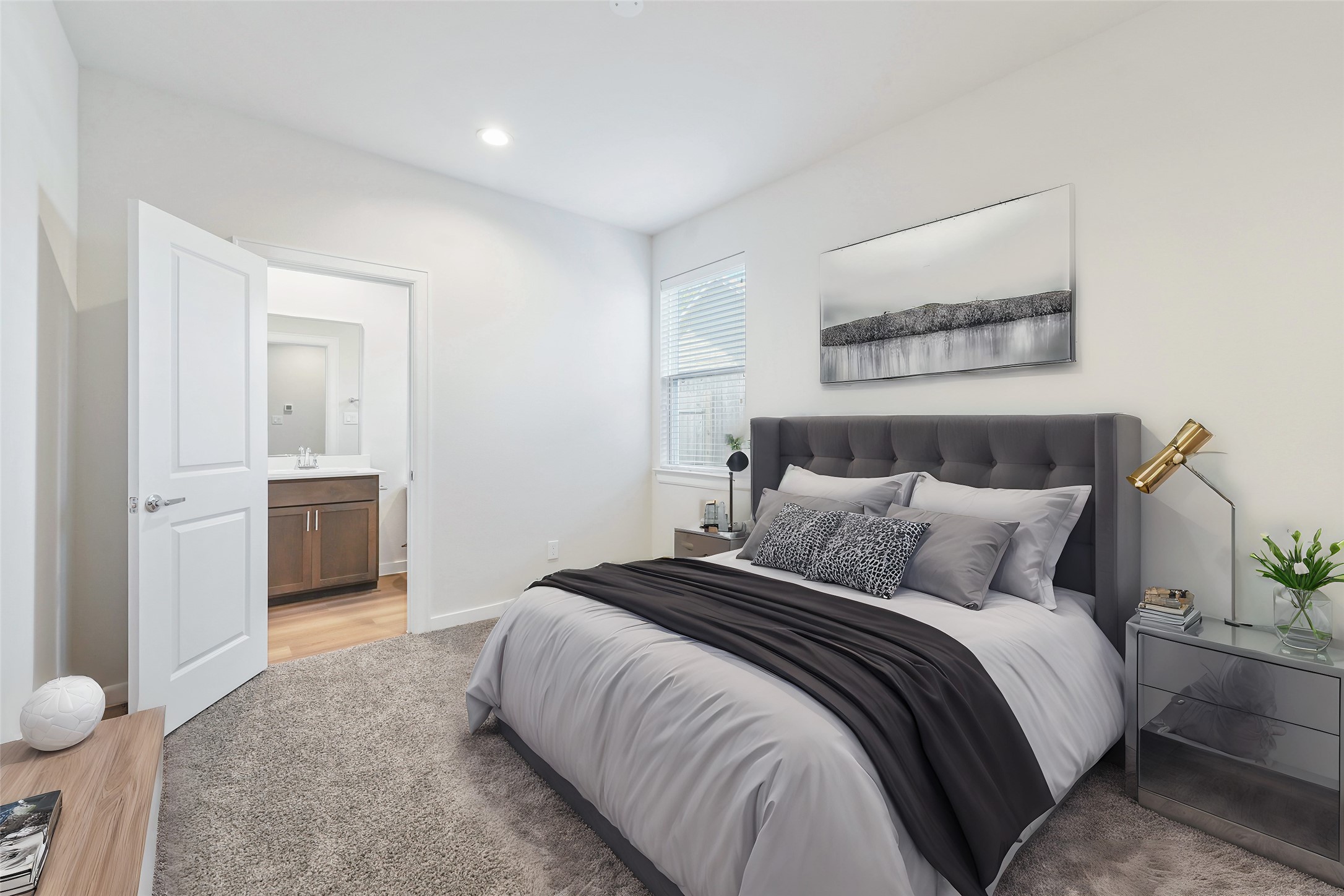 1013 Erin Street, Unit V Houston, TX 77009 - Photo 3 of 25 a bedroom with a bed and a painting on the wall