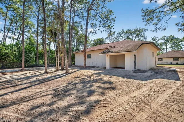 a house with trees in front of it
