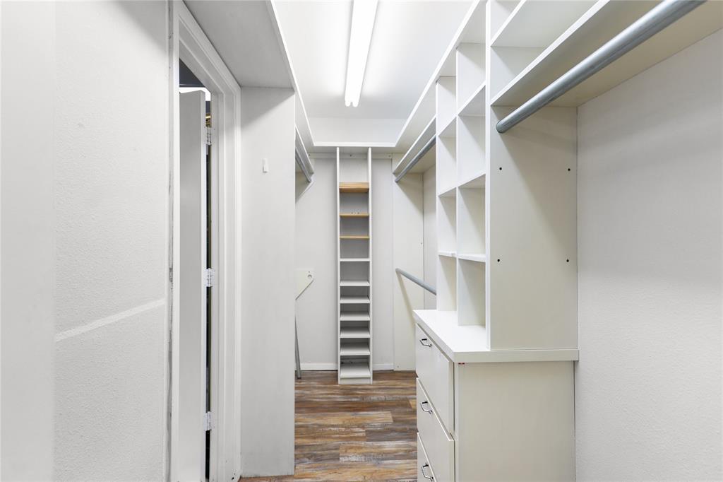 1109 Pine Ridge Drive Azle, TX 76020 - Photo 15 of 24 Spacious closet featuring white built-in shelving, drawers, and hanging rods