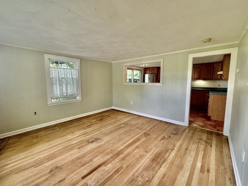 10 Beech Street Billerica, MA 01821 - Photo 5 of 21 a view of empty room with wooden floor and fan