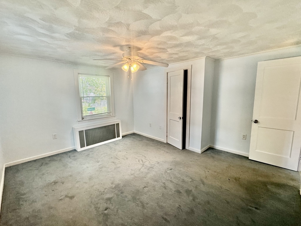 10 Beech Street Billerica, MA 01821 - Photo 8 of 21 an empty room with windows and closet