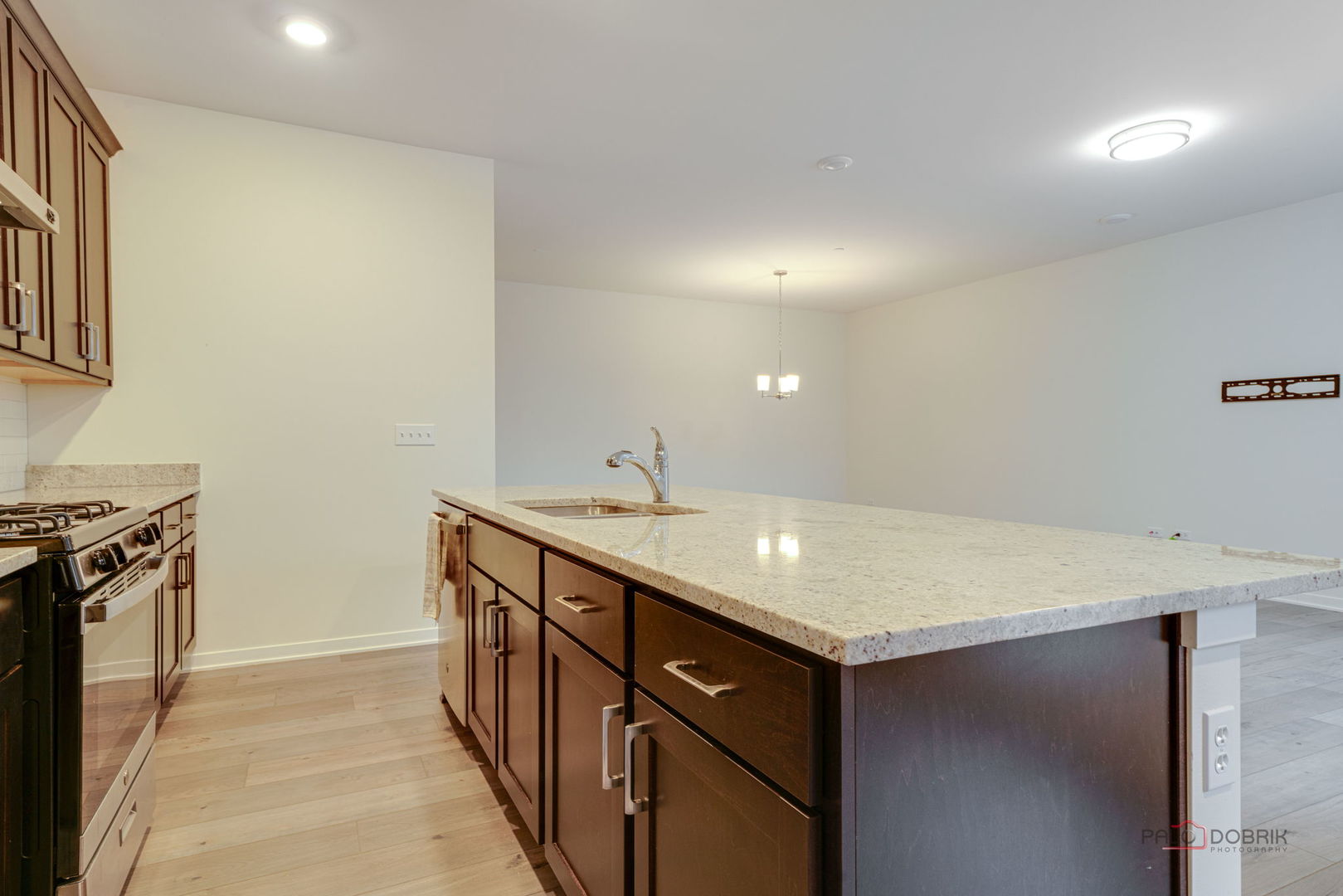 356 Hoffmann Drive Buffalo Grove, IL 60089 - Photo 18 of 35 a kitchen with a sink and a stove top oven