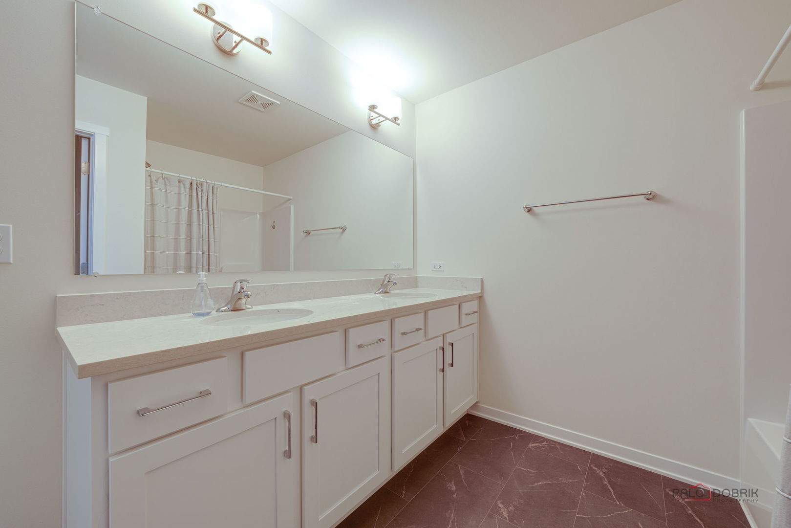 356 Hoffmann Drive Buffalo Grove, IL 60089 - Photo 24 of 35 a bathroom with a double vanity sink and a mirror