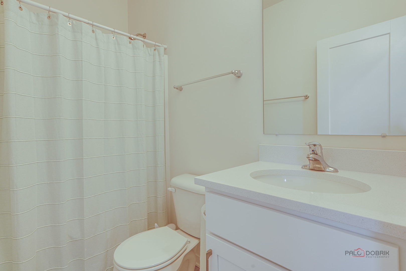 356 Hoffmann Drive Buffalo Grove, IL 60089 - Photo 5 of 35 a bathroom with a sink a toilet and a mirror