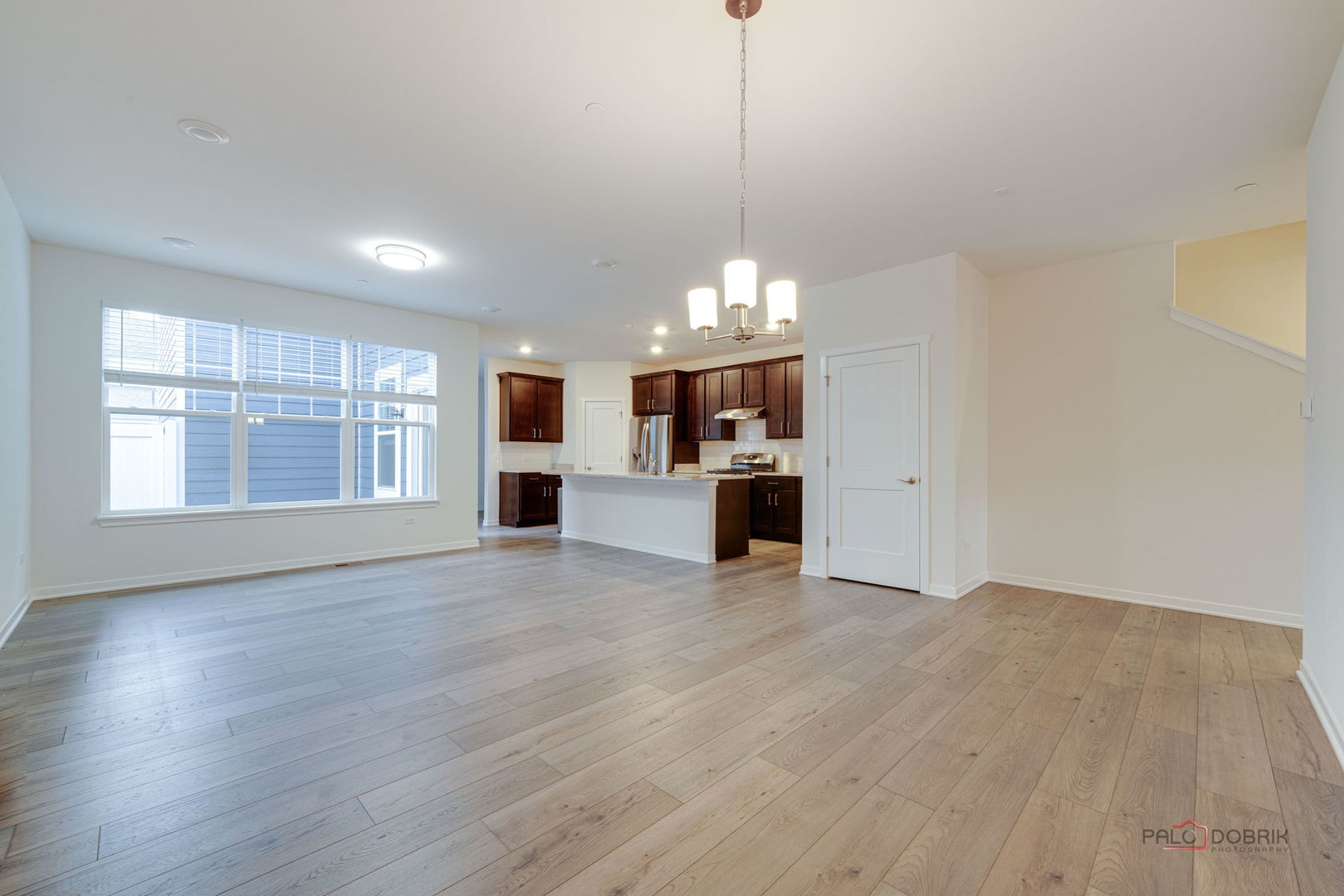 356 Hoffmann Drive Buffalo Grove, IL 60089 - Photo 9 of 35 a view of empty room with kitchen and window