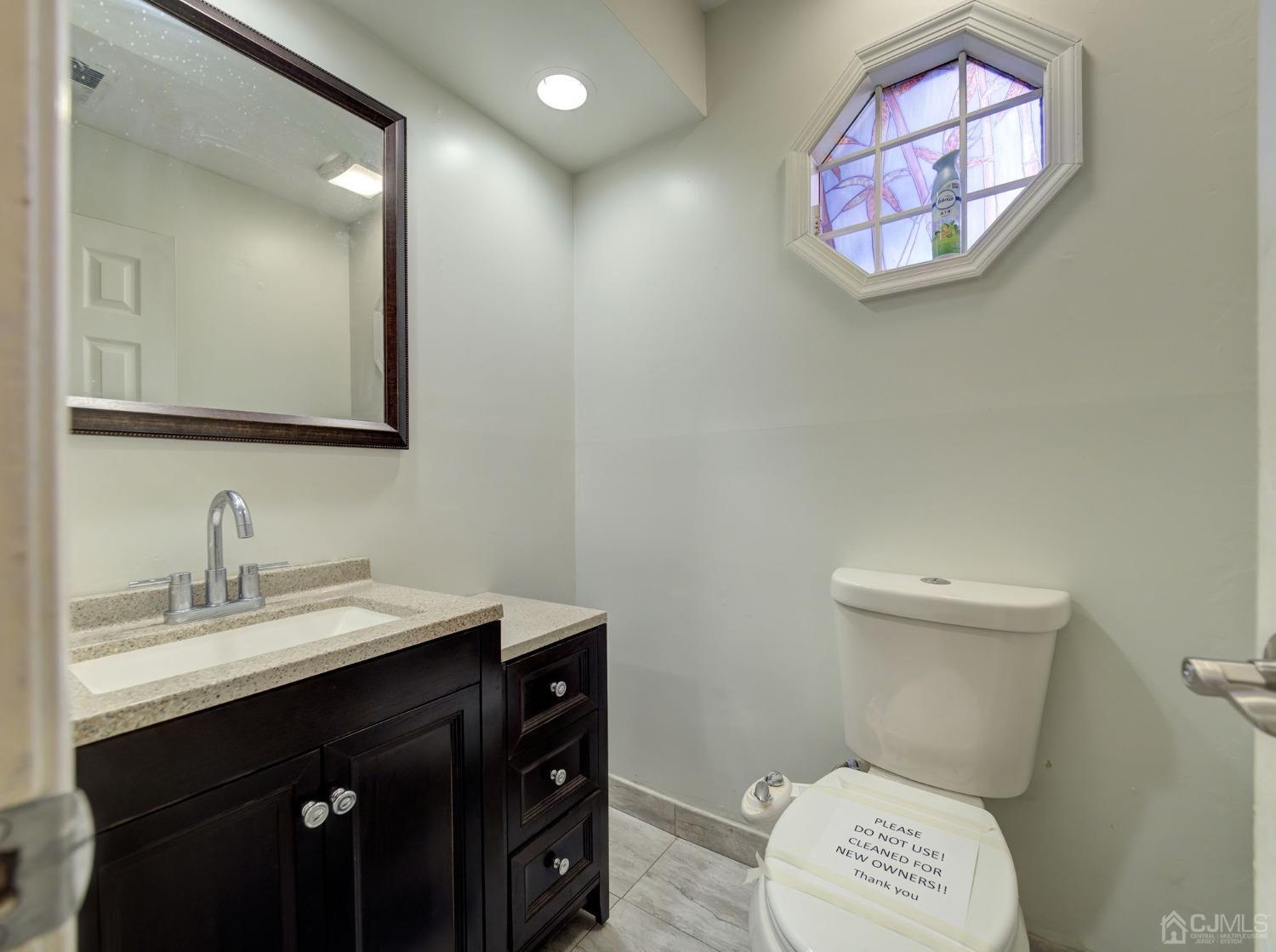 3802 Cricket Circle Edison, NJ 08820 - Photo 13 of 26 a bathroom with a sink mirror vanity and toilet