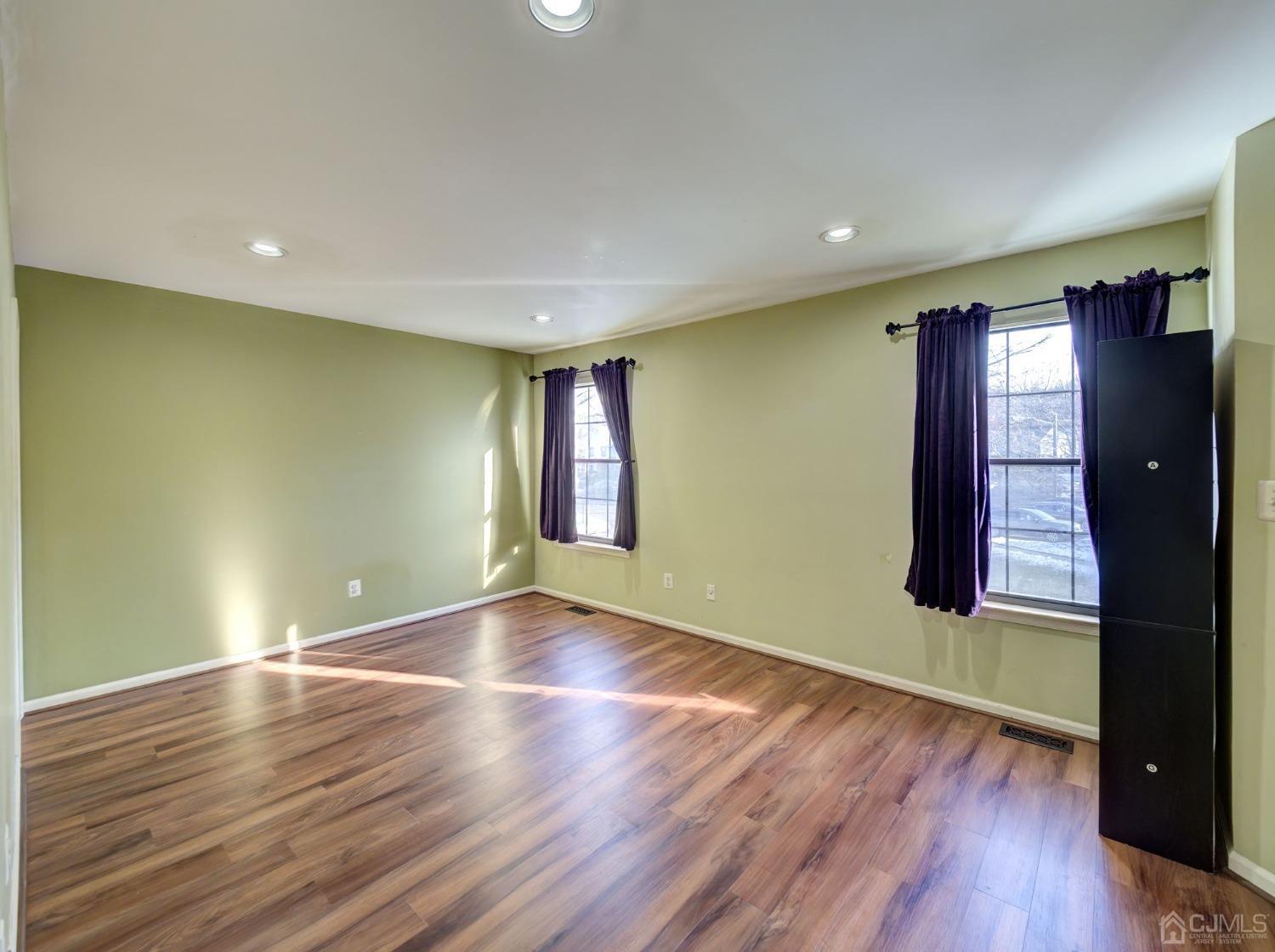 3802 Cricket Circle Edison, NJ 08820 - Photo 16 of 26 an empty room with wooden floor and windows