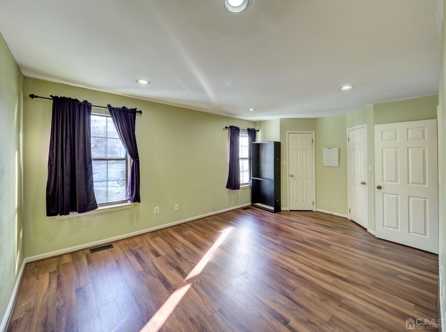 3802 Cricket Circle Edison, NJ 08820 - Photo 17 of 26 an empty room with wooden floor and windows