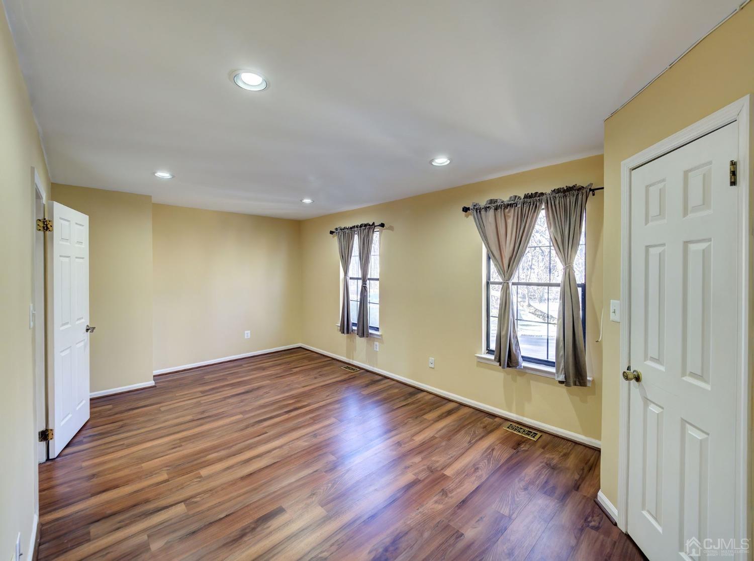 3802 Cricket Circle Edison, NJ 08820 - Photo 22 of 26 a view of empty room with wooden floor and fan