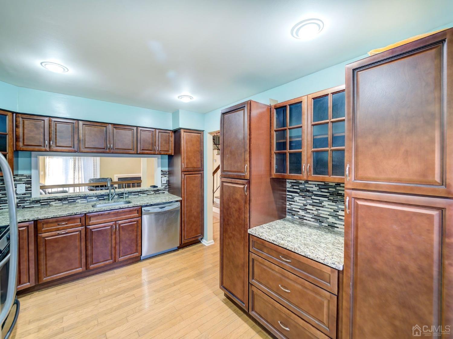 3802 Cricket Circle Edison, NJ 08820 - Photo 4 of 26 a kitchen with granite countertop a refrigerator and a sink