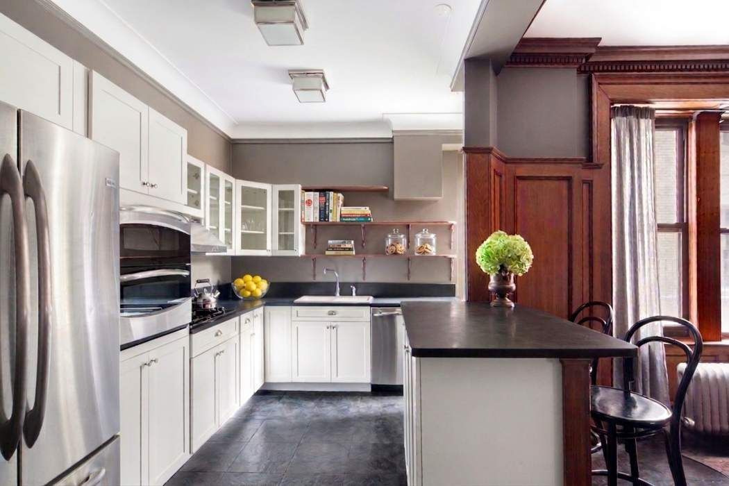 790 Riverside Drive, Unit 1J Manhattan, NY 10032 - Photo 3 of 22 a kitchen with stainless steel appliances granite countertop a sink stove and refrigerator