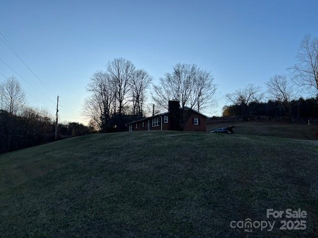2639 Fairview Road Marion, NC 28752 - Photo 2 of 42 a view of a field of grass and trees