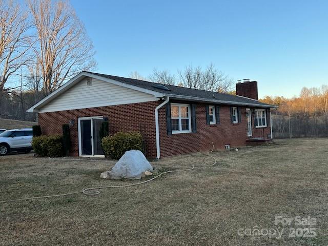 2639 Fairview Road Marion, NC 28752 - Photo 35 of 42 a front view of a house with a yard and garage