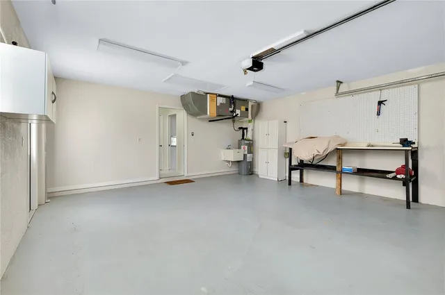 an aerial view of a house with outdoor space pool patio and lake view