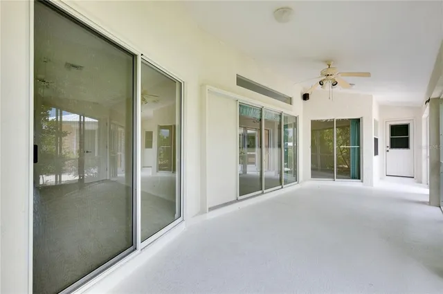 an aerial view of residential houses with outdoor space and lake view