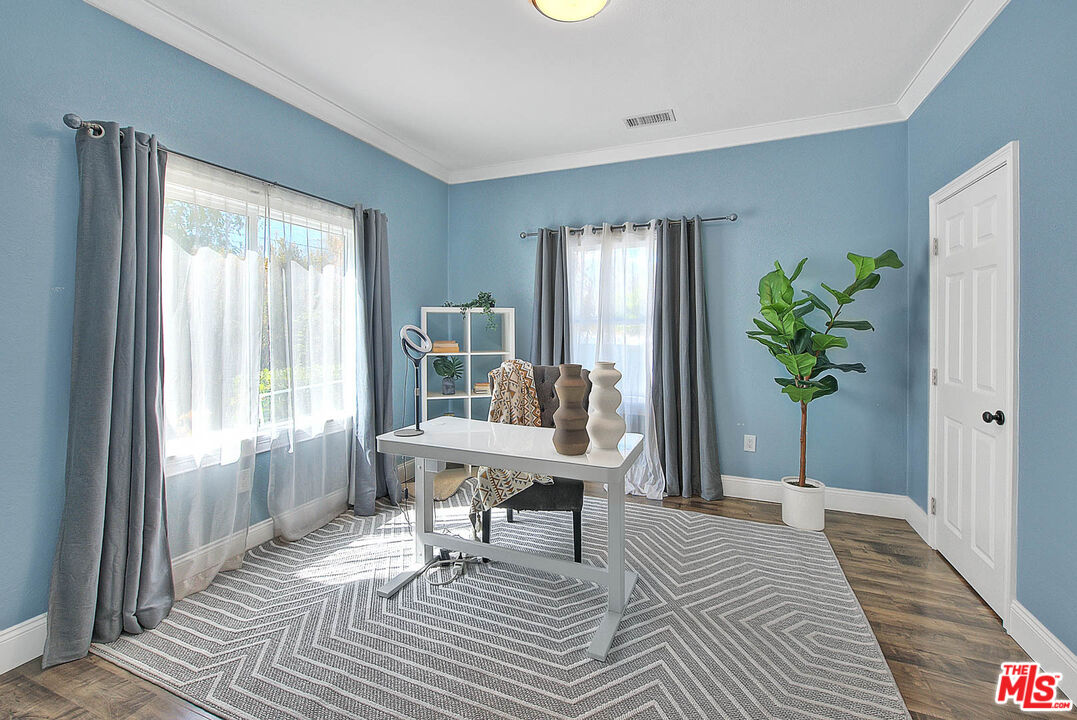 283 West Howard Street Pasadena, CA 91103 - Photo 11 of 21 a living room with a balcony furniture and a potted plant