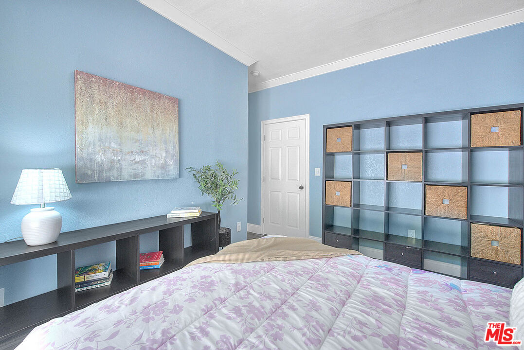 283 West Howard Street Pasadena, CA 91103 - Photo 14 of 21 a bedroom with a bed and a night stand