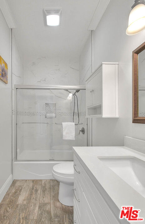 283 West Howard Street Pasadena, CA 91103 - Photo 15 of 21 a bathroom with a shower and a toilet