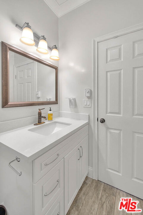 283 West Howard Street Pasadena, CA 91103 - Photo 16 of 21 a bathroom with a sink and a mirror