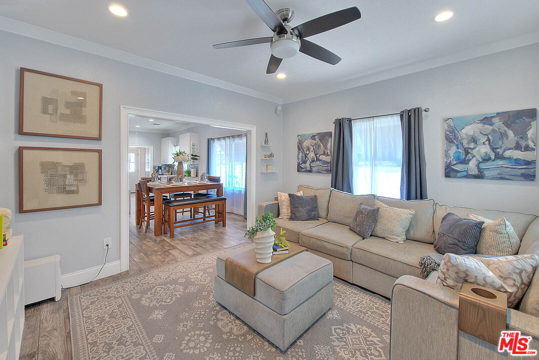283 West Howard Street Pasadena, CA 91103 - Photo 3 of 21 a living room with furniture and a view of kitchen