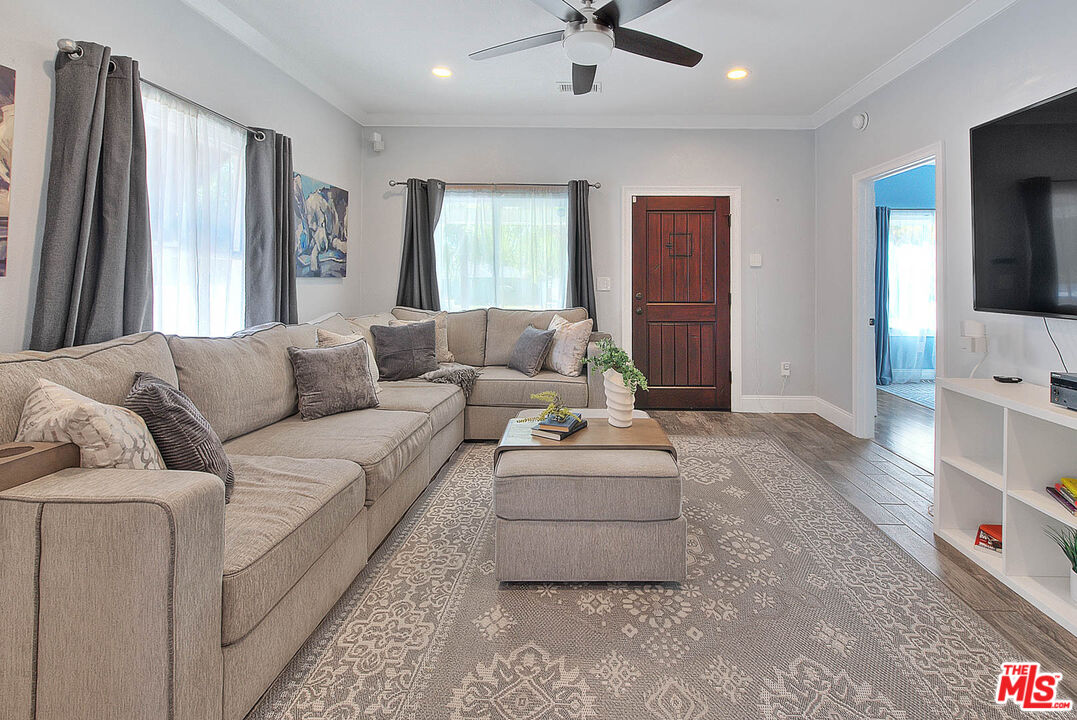 283 West Howard Street Pasadena, CA 91103 - Photo 4 of 21 a living room with furniture and a flat screen tv