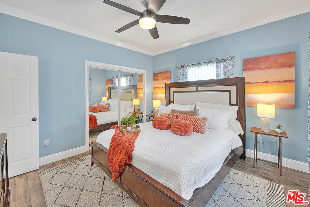 283 West Howard Street Pasadena, CA 91103 - Photo 9 of 21 a bedroom with a bed and window