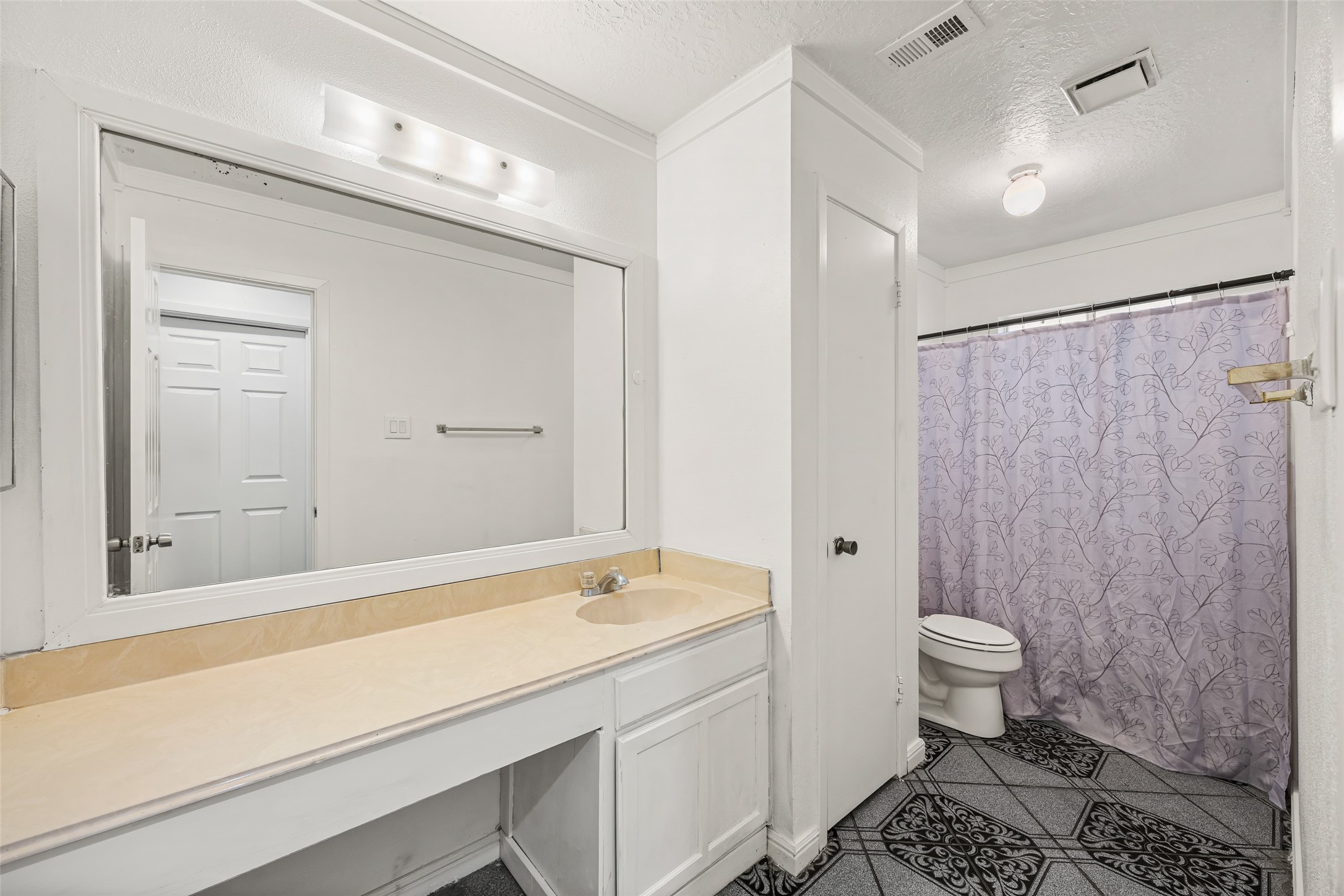 7226 Ridgeberry Drive Houston, TX 77095 - Photo 13 of 31 a bathroom with a sink a toilet and shower