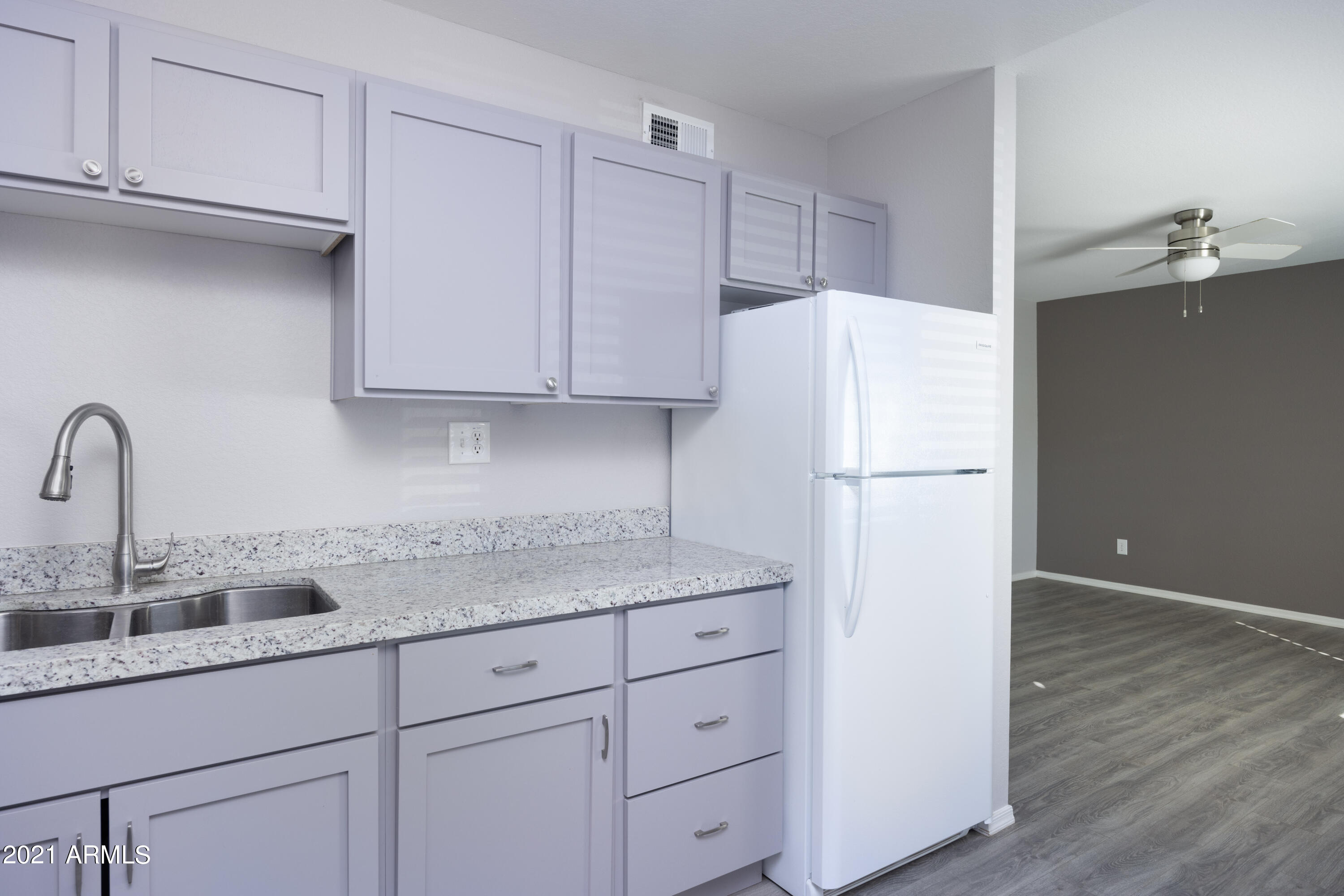 15605 North 29th Street, Unit 12 Phoenix, AZ 85032 - Photo 12 of 25 a kitchen with appliances and cabinets