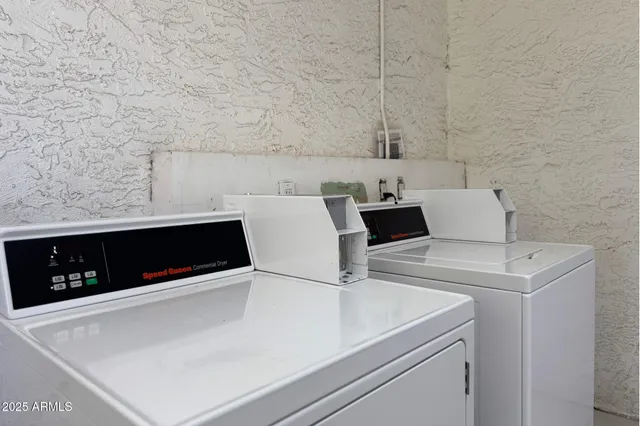 a close view of utility room with washer and dryer