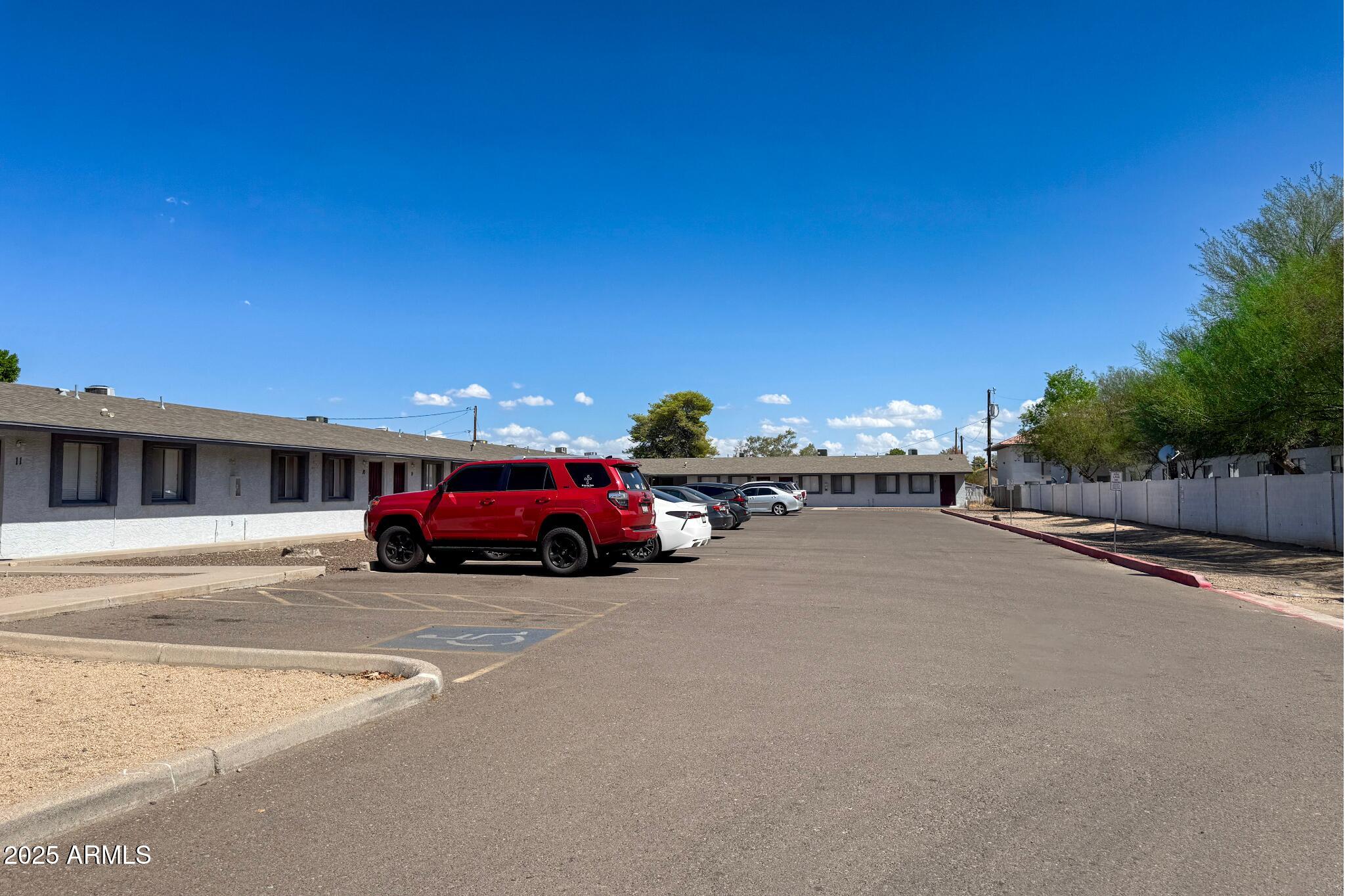 15605 North 29th Street, Unit 12 Phoenix, AZ 85032 - Photo 3 of 25 a view of a cars park in front of a building