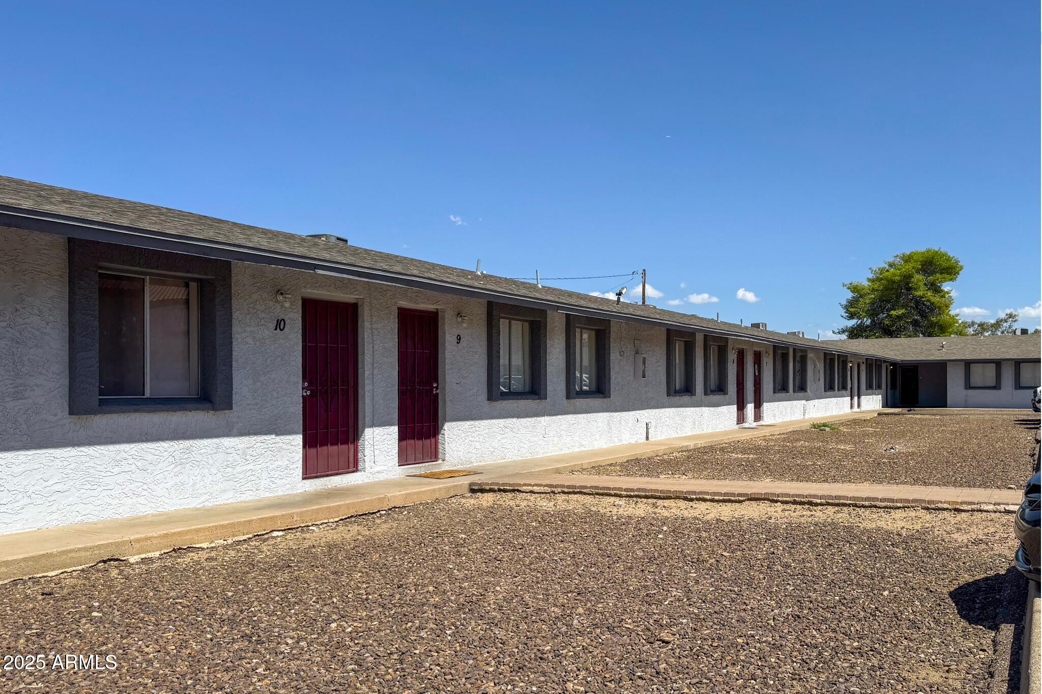 15605 North 29th Street, Unit 12 Phoenix, AZ 85032 - Photo 4 of 25 a front view of a house with a yard