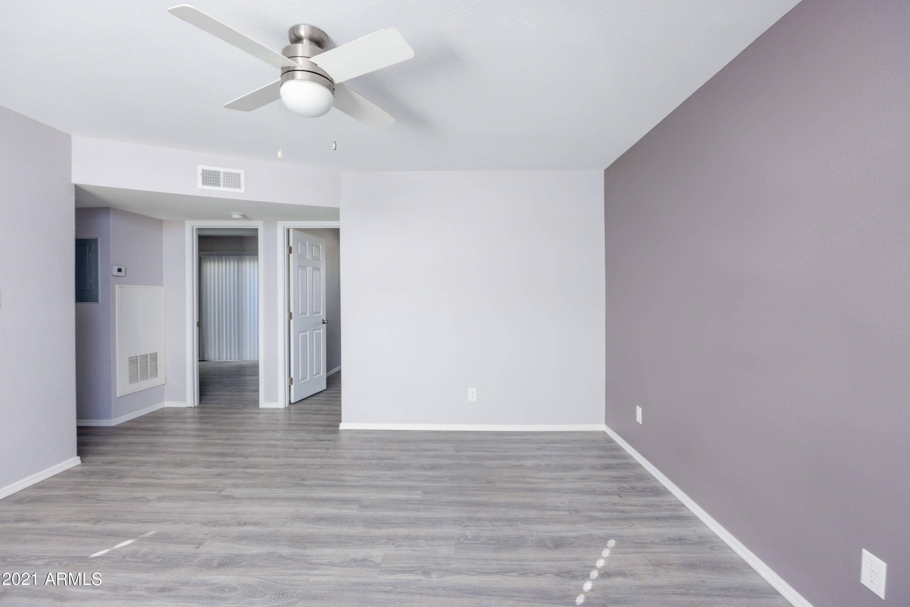 15605 North 29th Street, Unit 12 Phoenix, AZ 85032 - Photo 7 of 25 a view of an empty room with wooden floor
