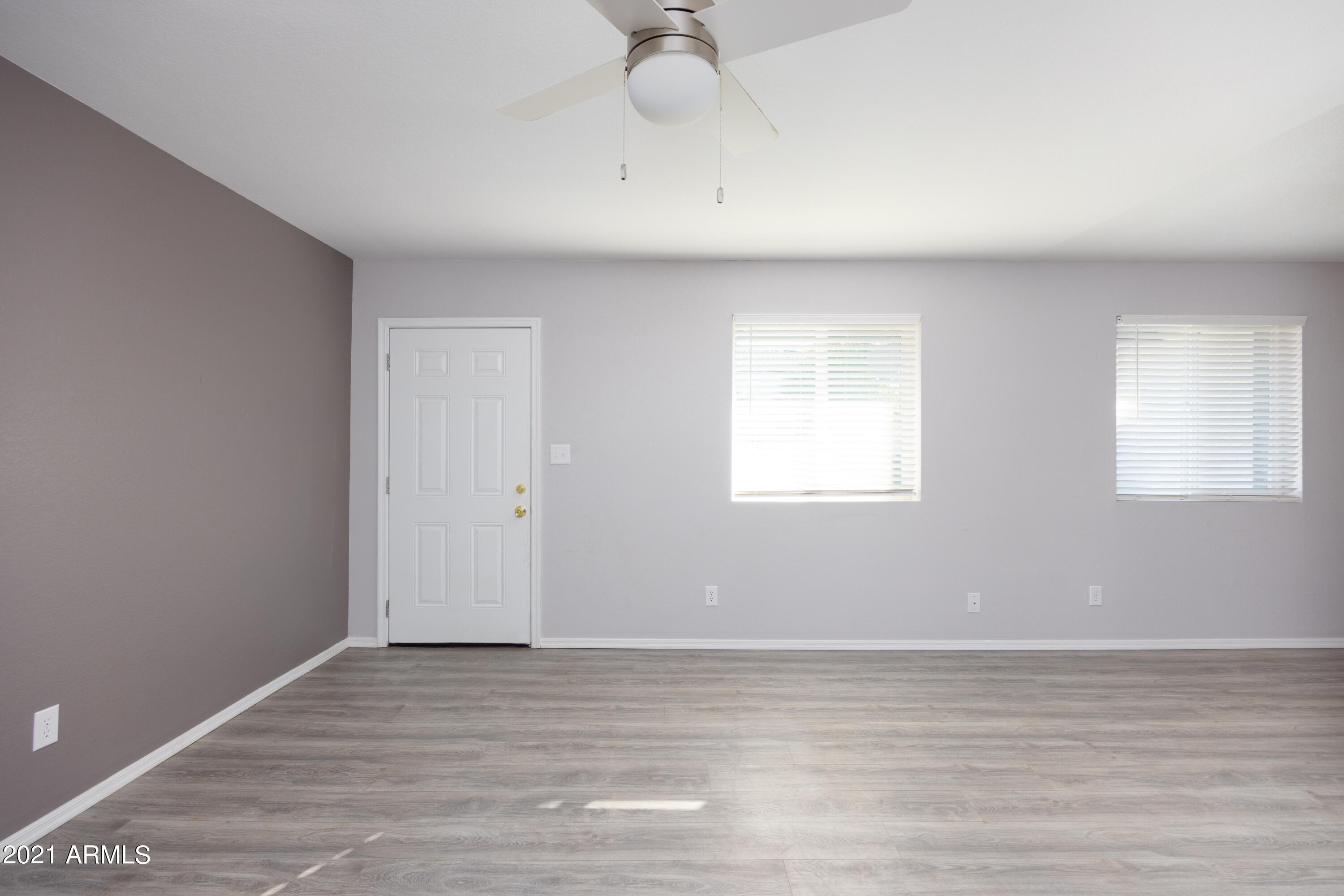 15605 North 29th Street, Unit 12 Phoenix, AZ 85032 - Photo 9 of 25 a view of a livingroom with wooden floor and a window