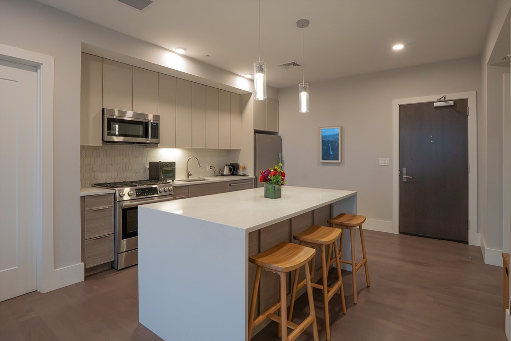 a kitchen with a table and chairs in it