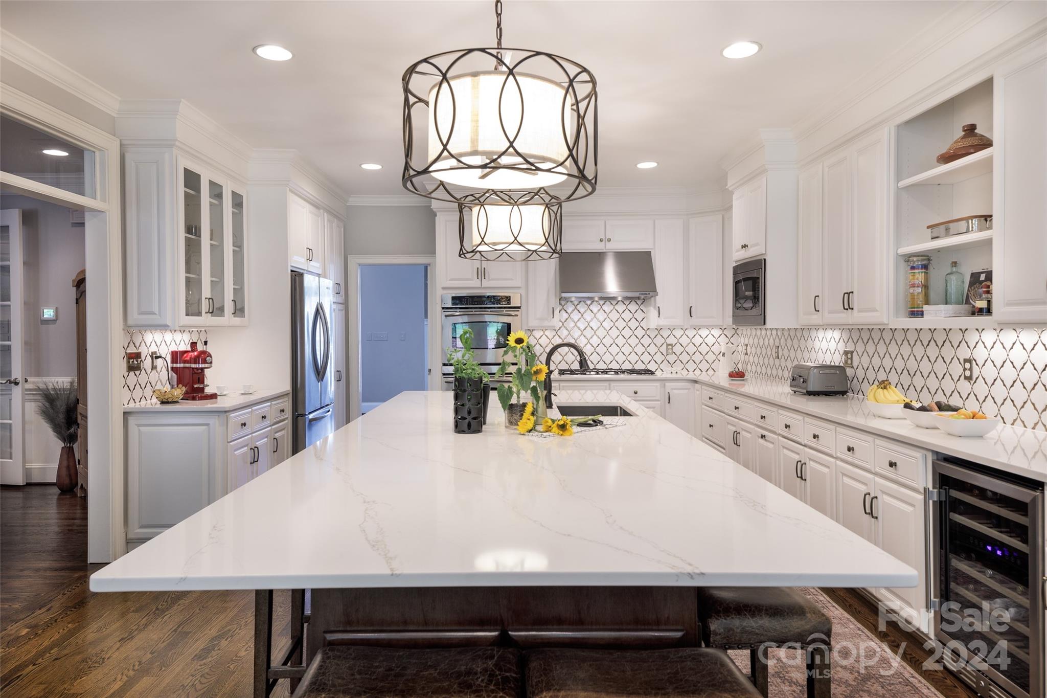 1201 Lost Oak Road Charlotte, NC 28270 - Photo 13 of 46 a large kitchen with sink a refrigerator and chandelier