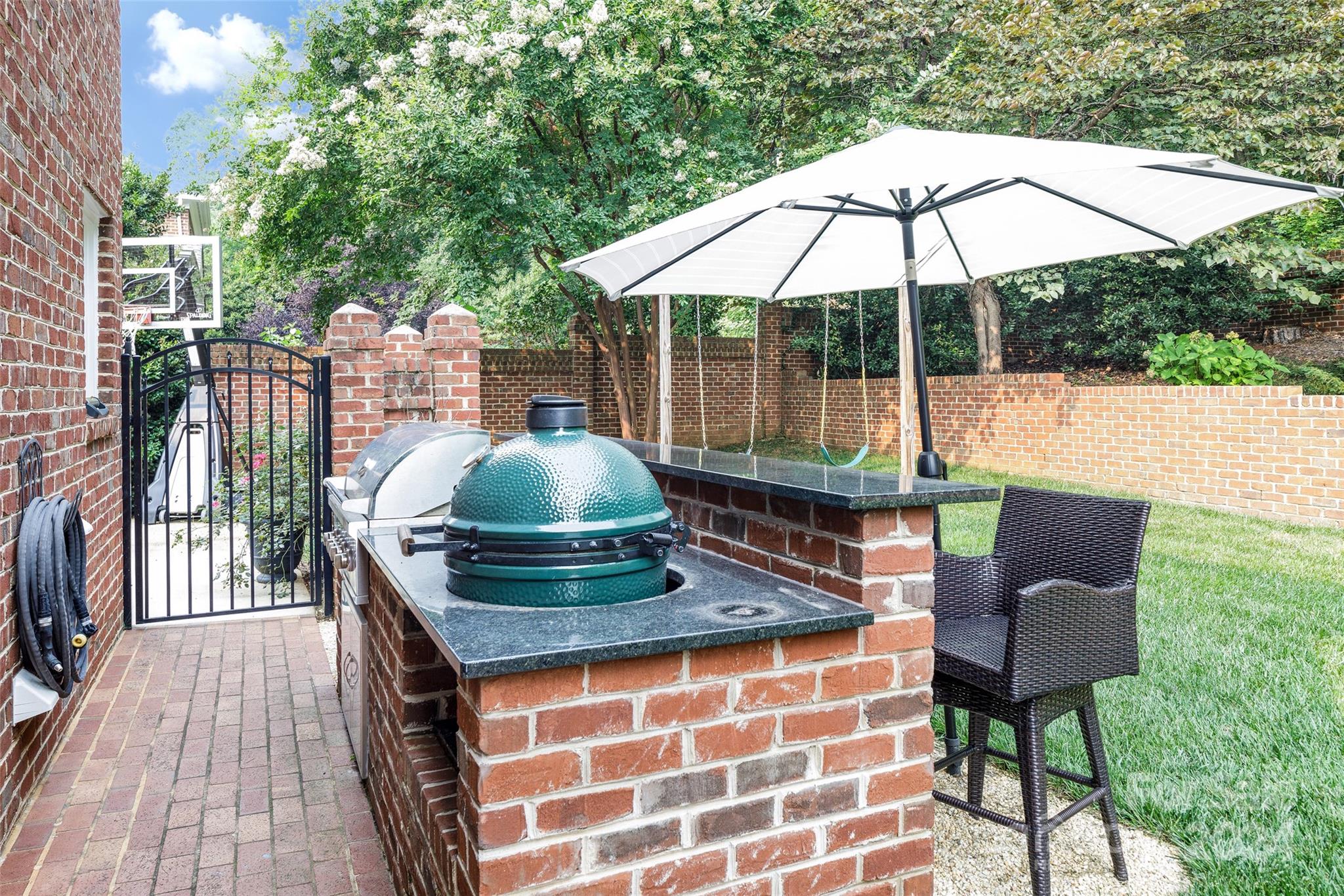 1201 Lost Oak Road Charlotte, NC 28270 - Photo 23 of 46 a backyard of a house with table and chairs