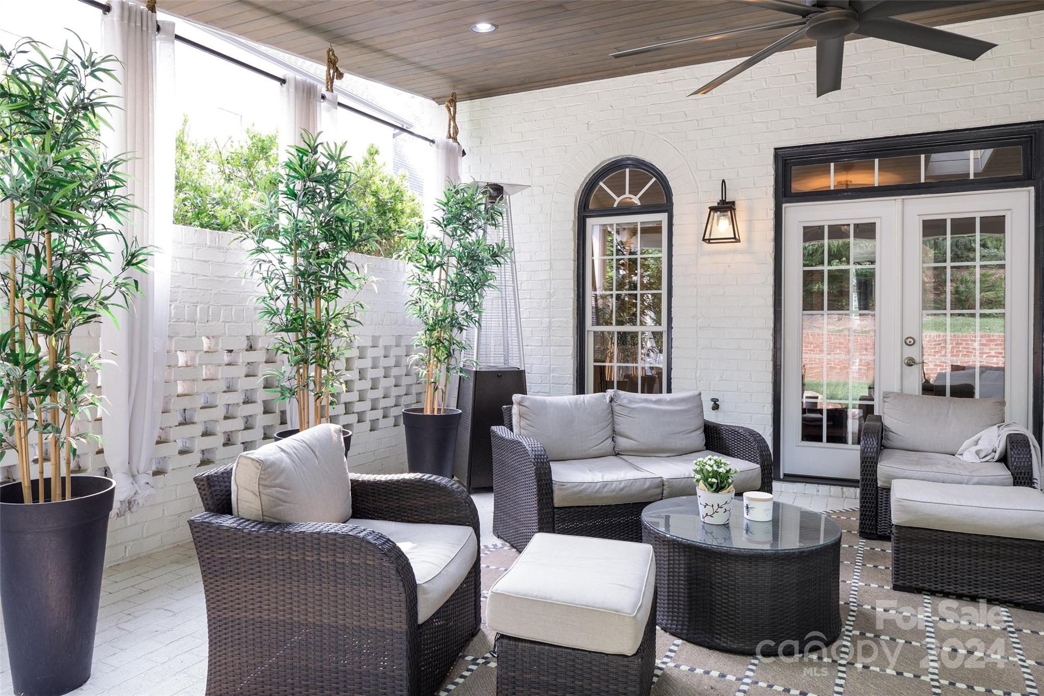 1201 Lost Oak Road Charlotte, NC 28270 - Photo 25 of 46 a view of a patio with couches table and chairs and potted plants