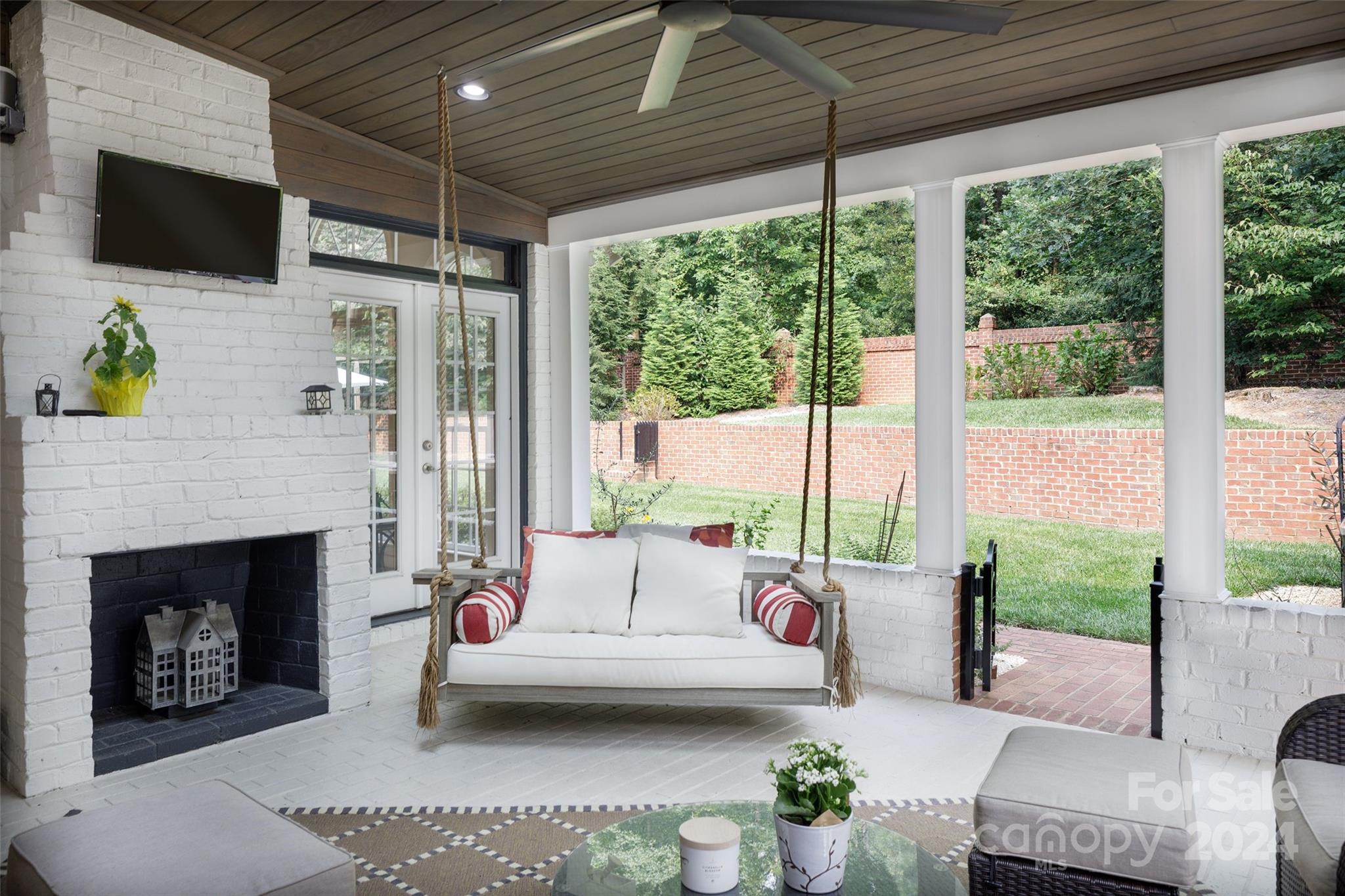 1201 Lost Oak Road Charlotte, NC 28270 - Photo 26 of 46 a living room with furniture a fireplace a flat screen tv and a large window