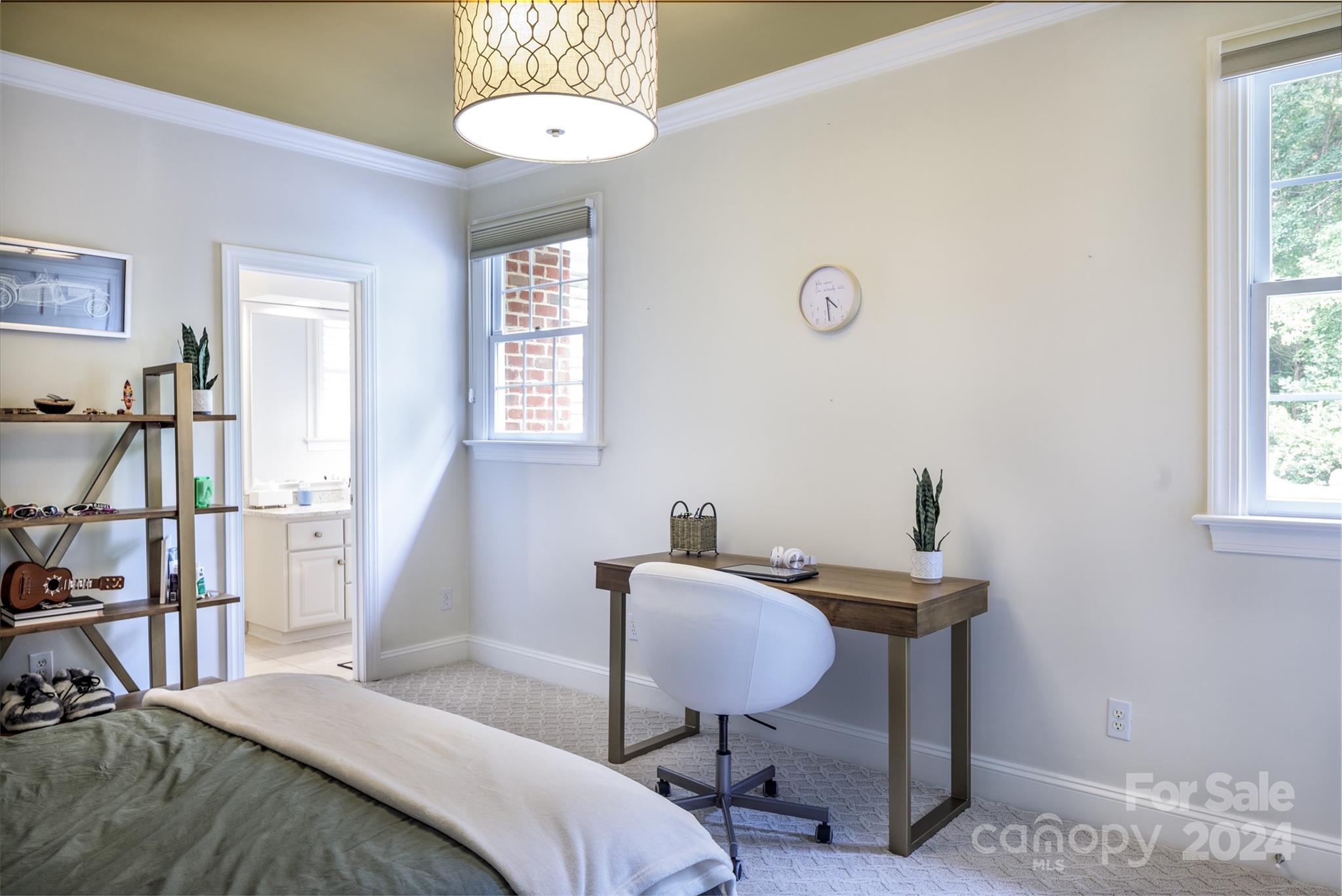 1201 Lost Oak Road Charlotte, NC 28270 - Photo 30 of 46 a bedroom with a bed and a chandelier