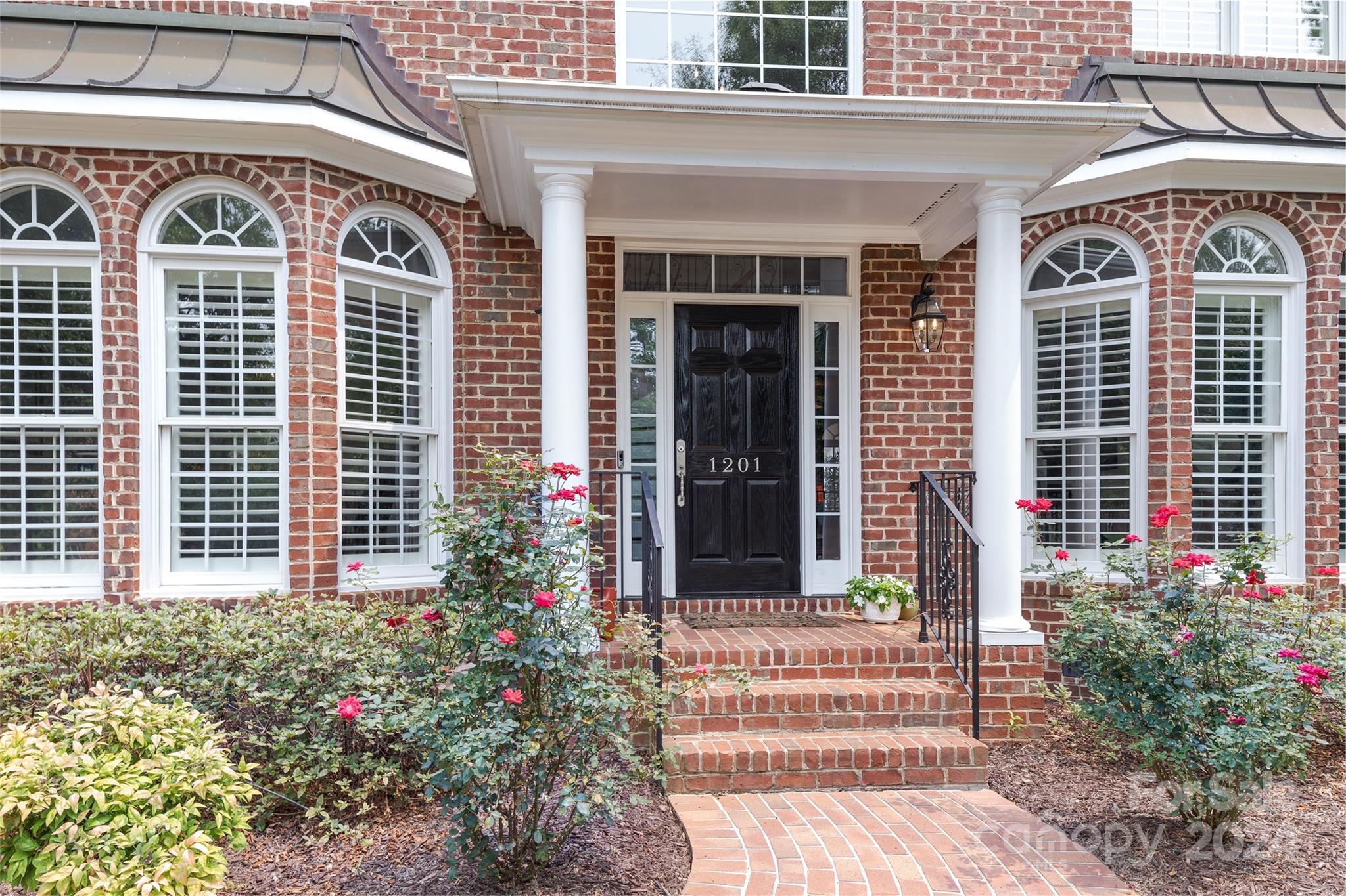 1201 Lost Oak Road Charlotte, NC 28270 - Photo 3 of 46 a front view of a house with a garden