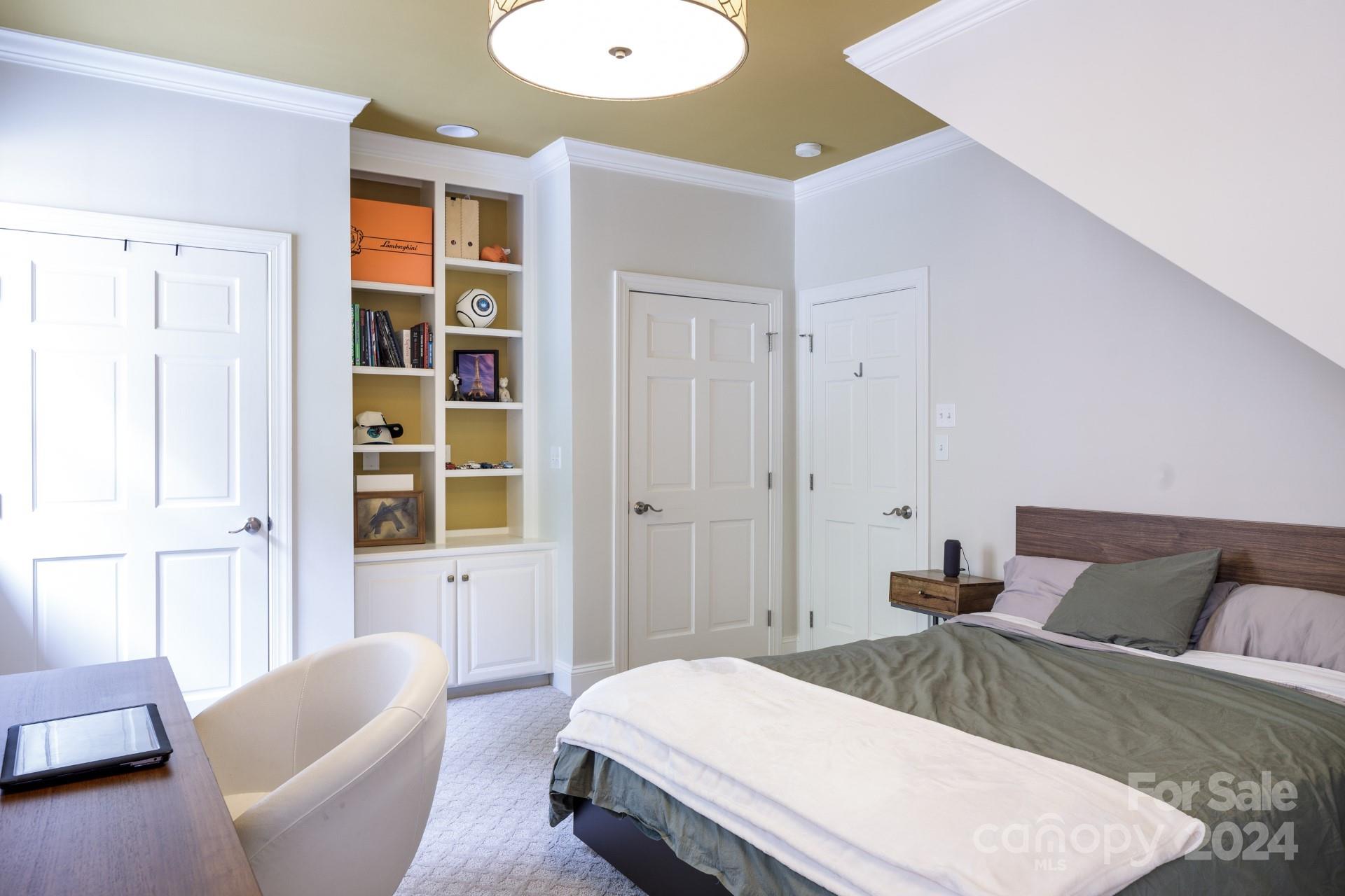 1201 Lost Oak Road Charlotte, NC 28270 - Photo 31 of 46 a bedroom with a bed and a couch