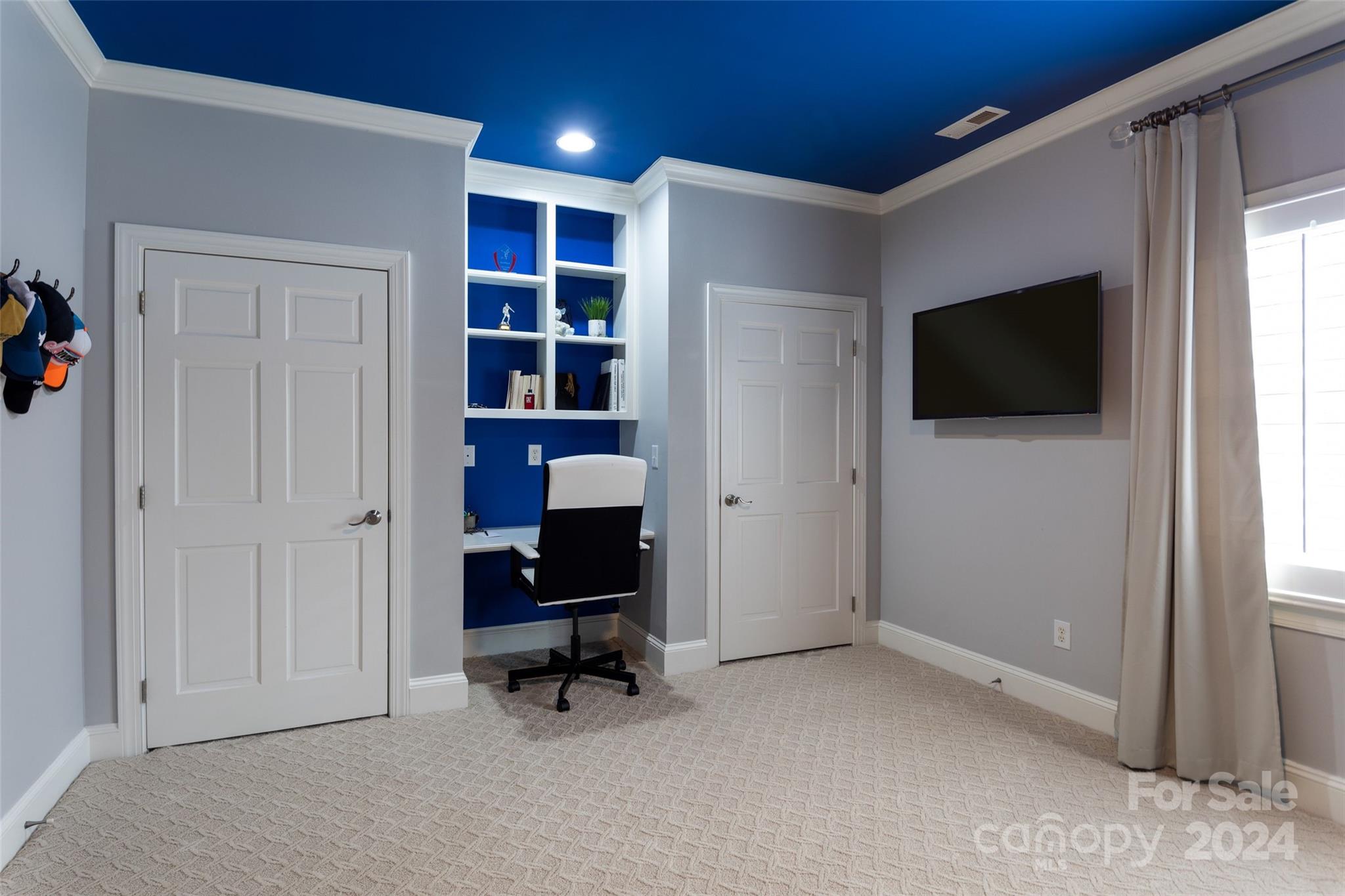 1201 Lost Oak Road Charlotte, NC 28270 - Photo 32 of 46 a view of a livingroom with furniture and a flat screen tv