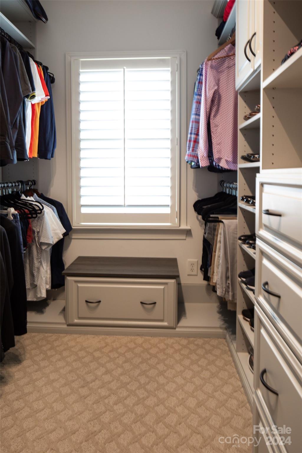 1201 Lost Oak Road Charlotte, NC 28270 - Photo 36 of 46 a view of walk in closet with clothes and shoes